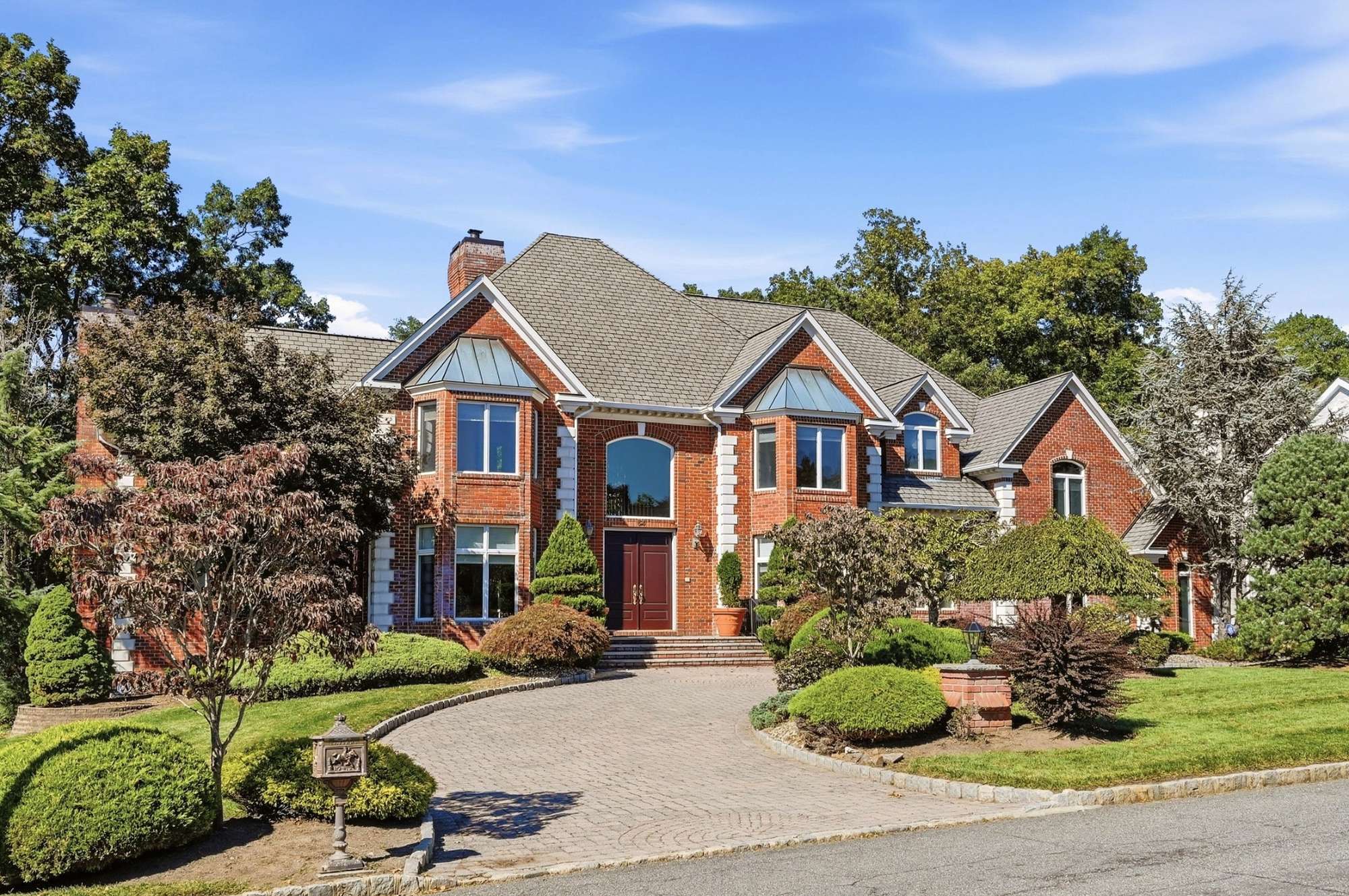 Front facade and landscaped approach at 54 Burnet Hill Road, Livingston