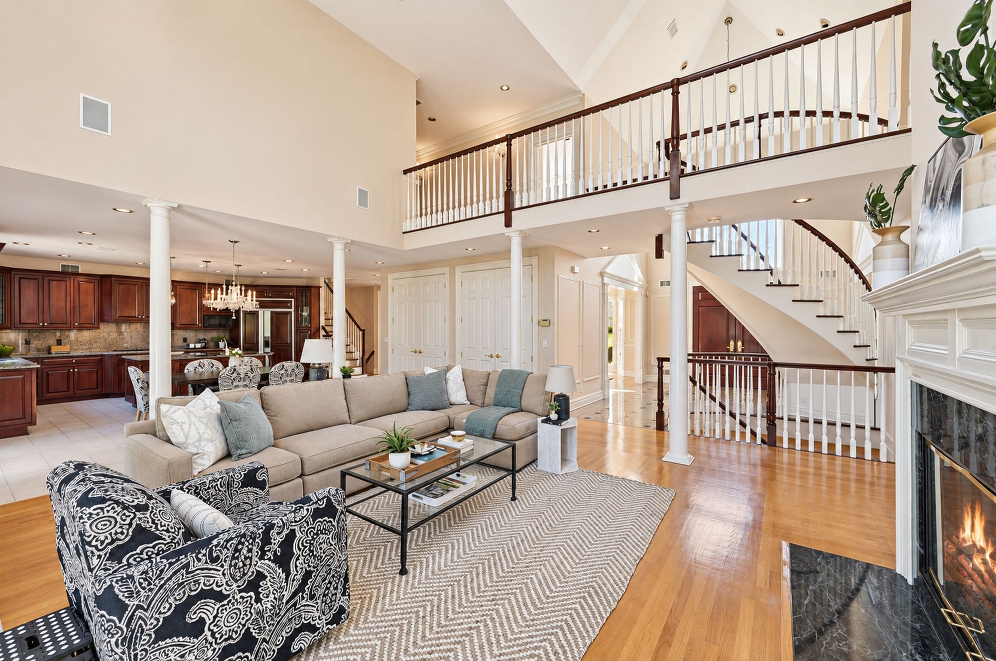 Great room with the staircase and balcony beyond at 54 Burnet Hill Road, Livingston