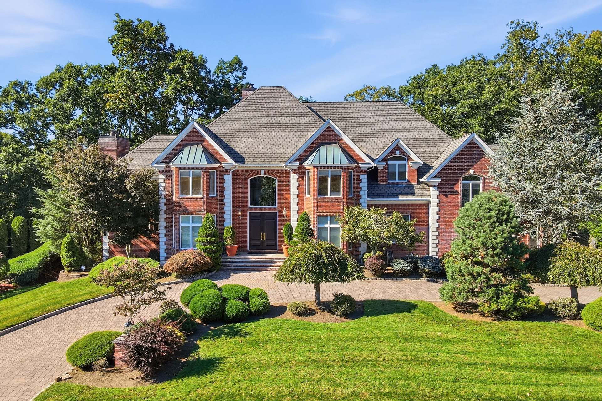 All-brick front facade and circular paver driveway of 54 Burnet Hill Road, Livingston, NJ