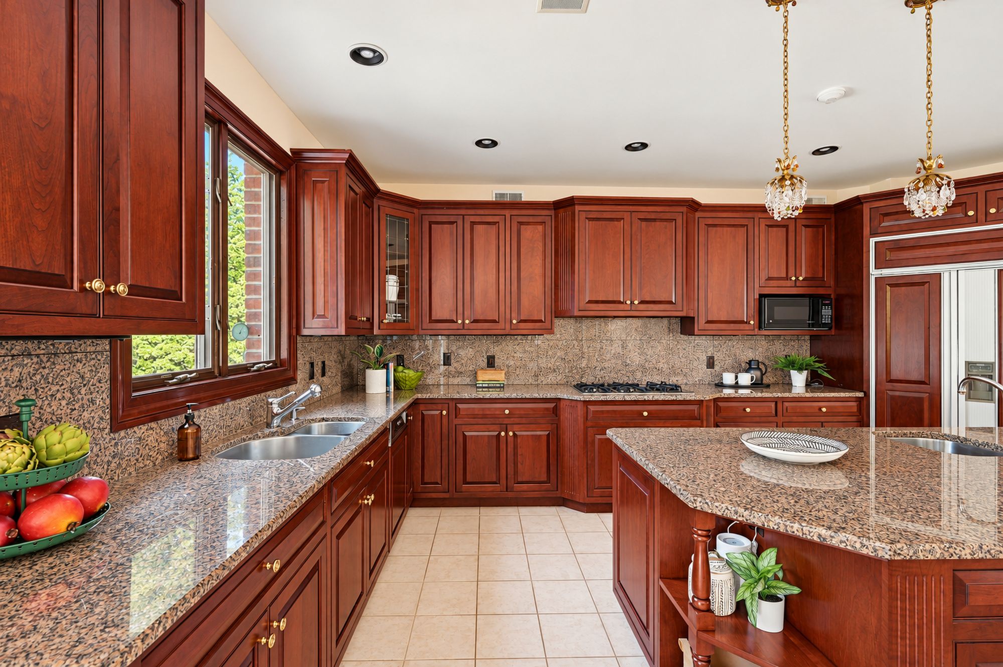 Kitchen with custom cabinetry, granite countertops, and center island at 54 Burnet Hill Road, Livingston