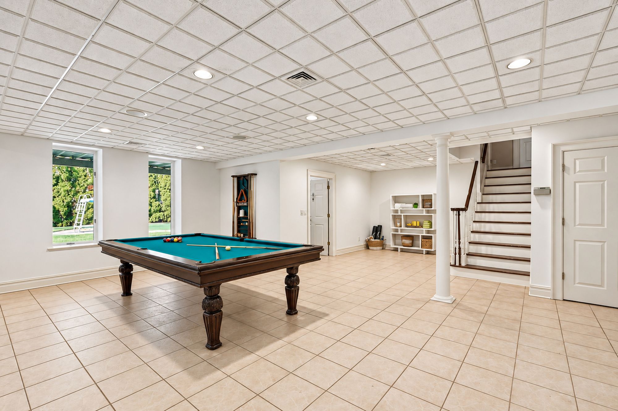 Lower-level recreation room and stair at 54 Burnet Hill Road, Livingston