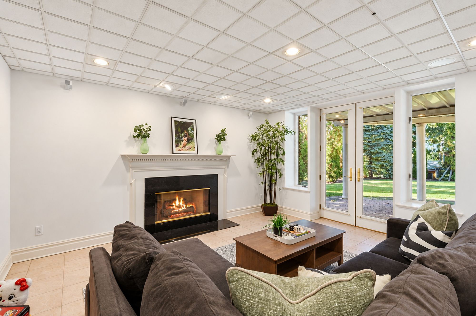 Lower-level media area with fireplace at 54 Burnet Hill Road, Livingston