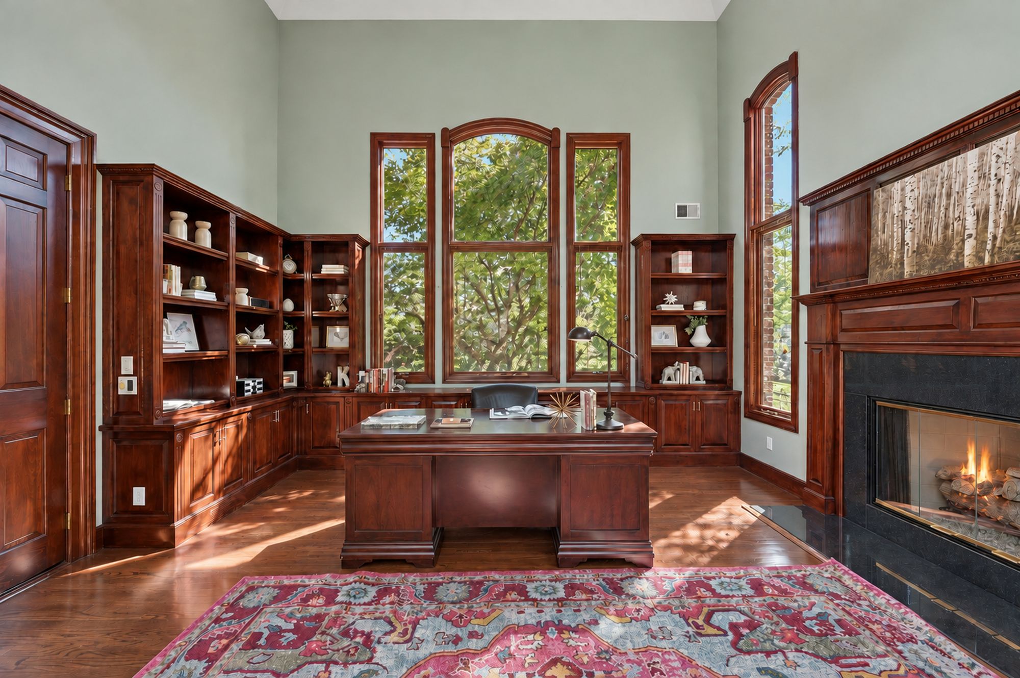 Private office with fireplace and built-in shelving at 54 Burnet Hill Road, Livingston