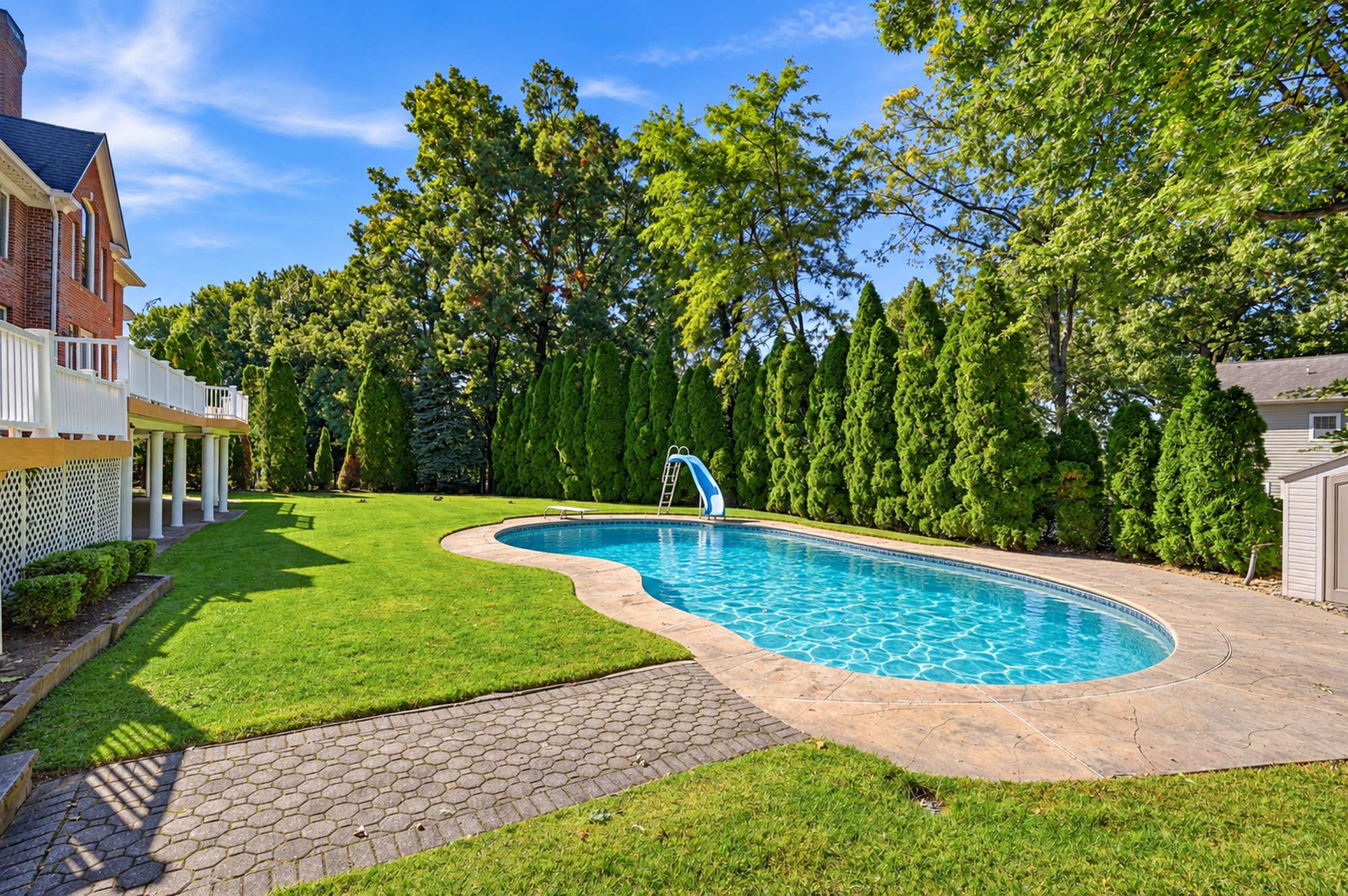 Heated pool and rear lawn at 54 Burnet Hill Road, Livingston