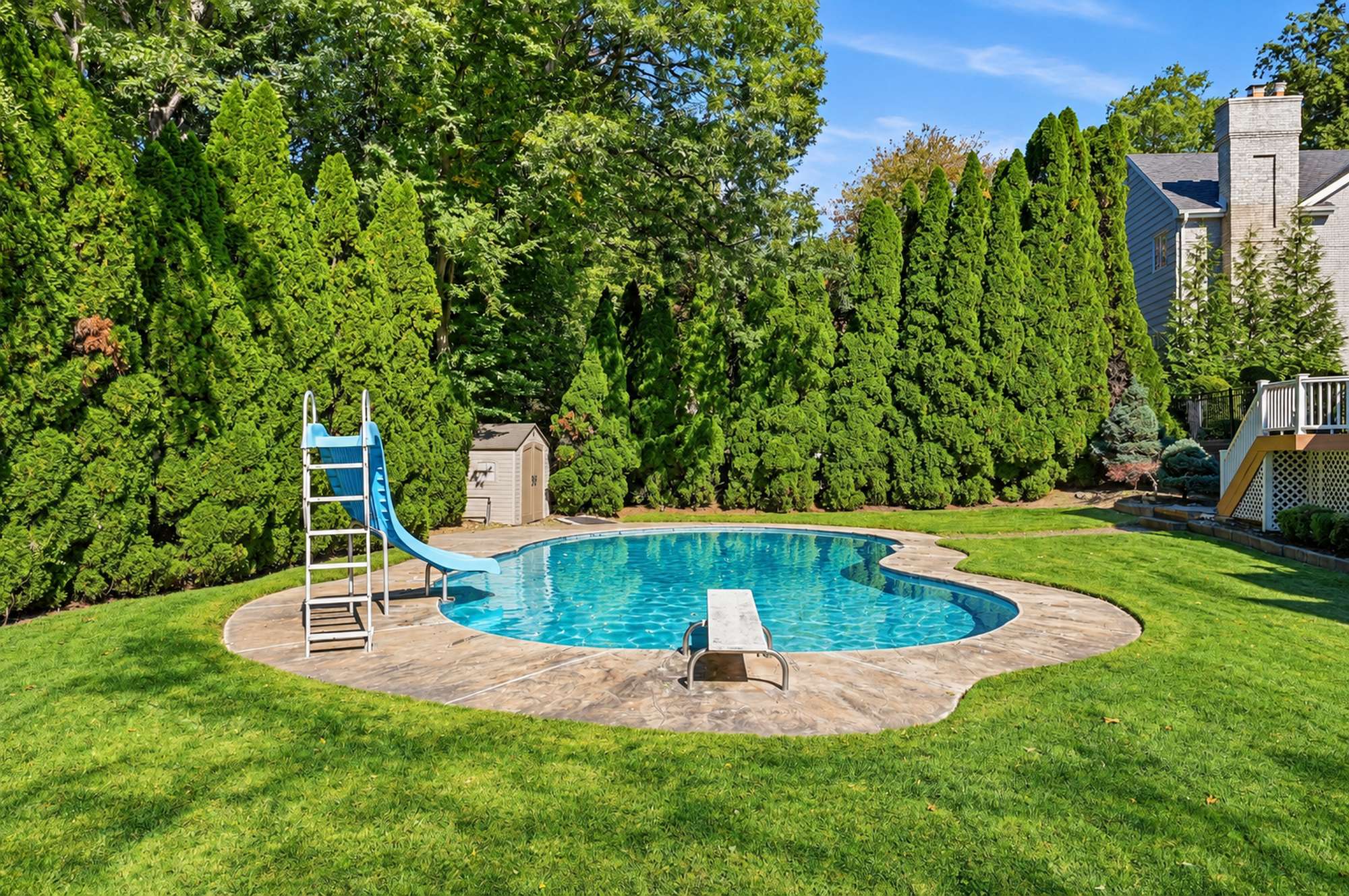 Heated pool and landscaped grounds at 54 Burnet Hill Road, Livingston