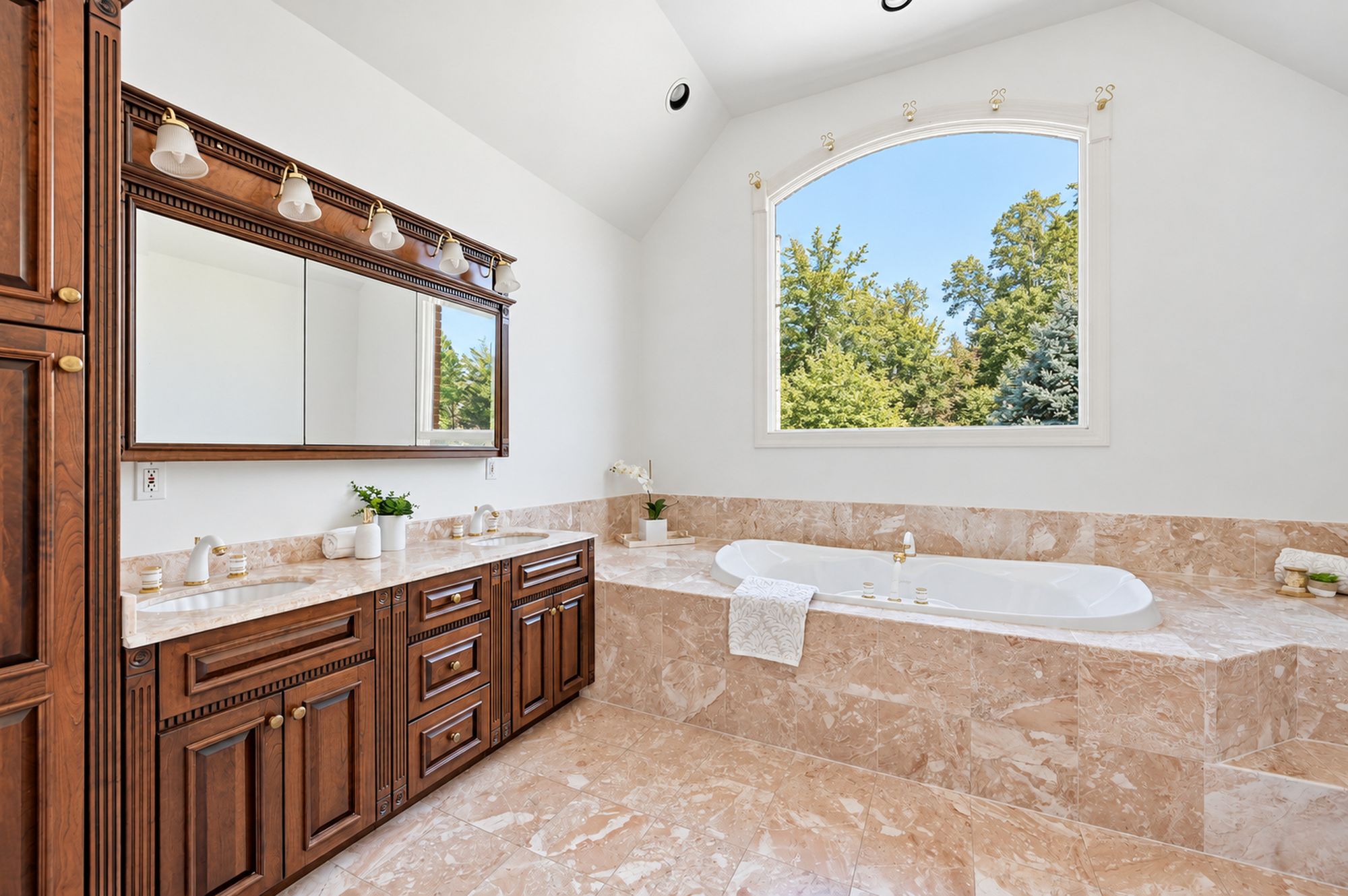 Primary bath vanity and soaking tub at 54 Burnet Hill Road, Livingston