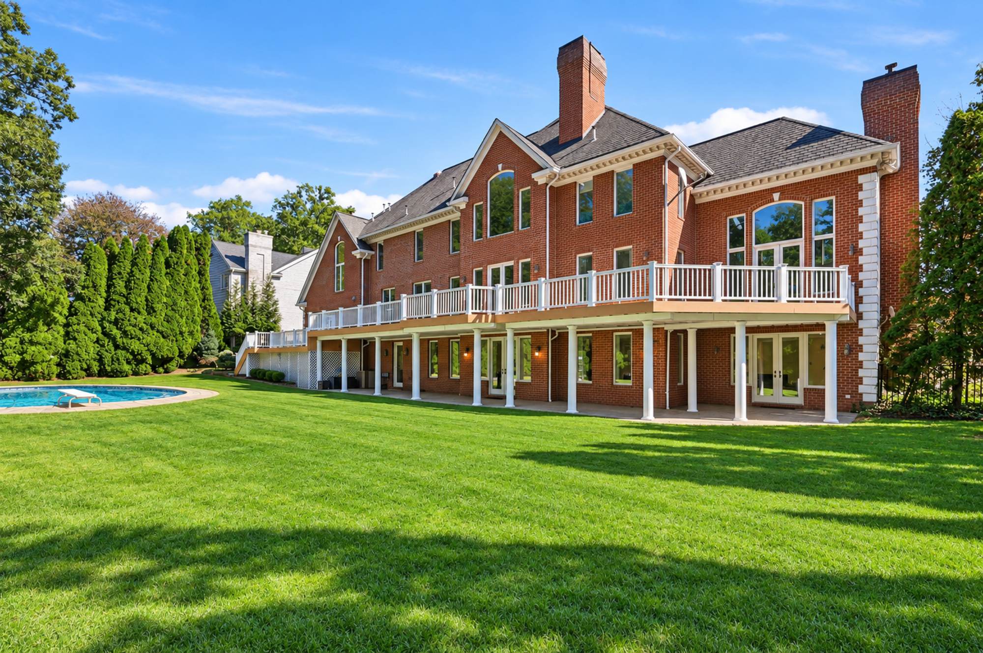 Rear lawn and deck at 54 Burnet Hill Road, Livingston